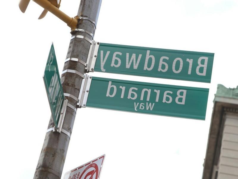 show street sign that says broadway and sign underneath that reads barnard way